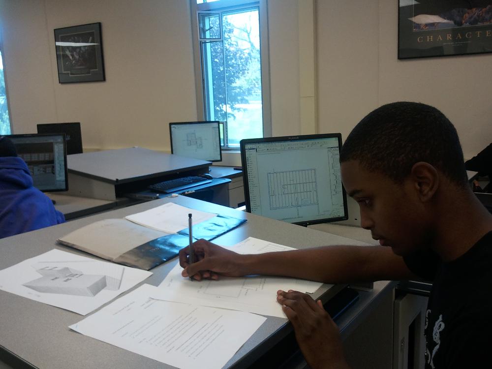 A student works on his design in CAD class.