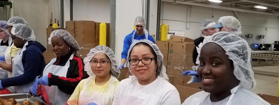 The action never stops for members of the T.F. North Action Team as they volunteer at the Food Depository.