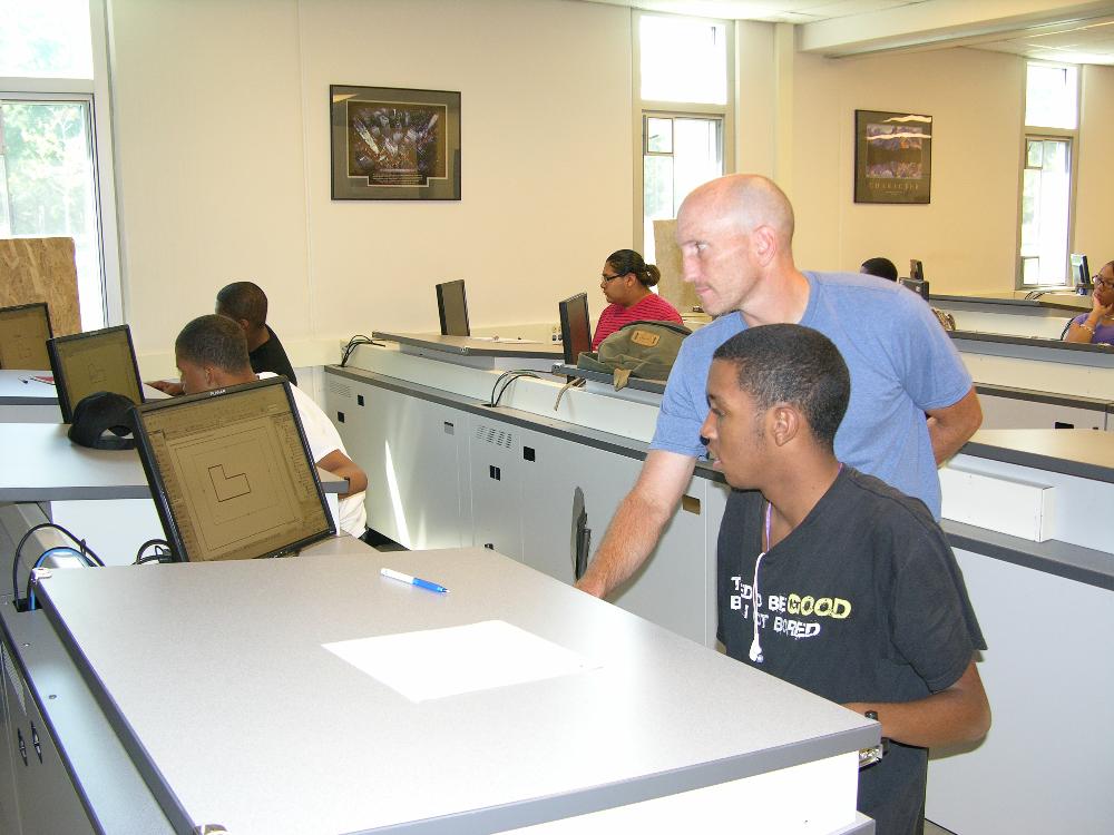 Mr. Coultas assisting a student