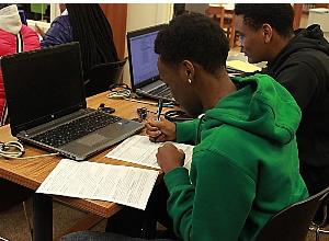 Seniors completing college applications during all school testing day.