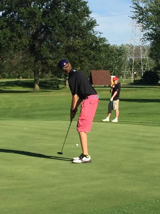 Mitch Barnum watches as DJ Altgilbers putts for birdie at LCC.